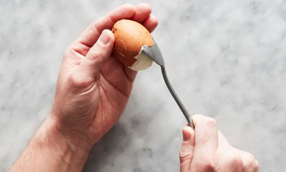 Using a Spoon to Remove Egg Shells